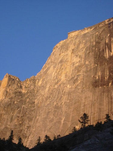 Half Dome as seen from the approach with warm evening light.