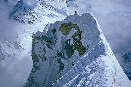 Mark Westman climbing along the knife-edge ridge section of Mt. Forake...
