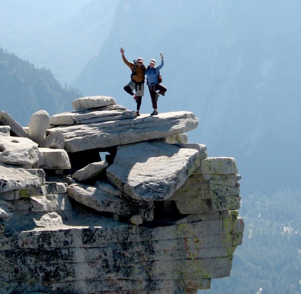 Photo opportunity on Half Dome's diving board, following climbing Snak...