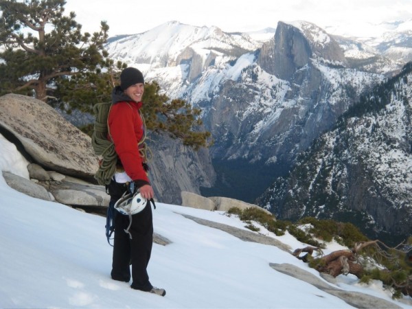 Chris McNamara on the snowy descent with Half Dome in the background.