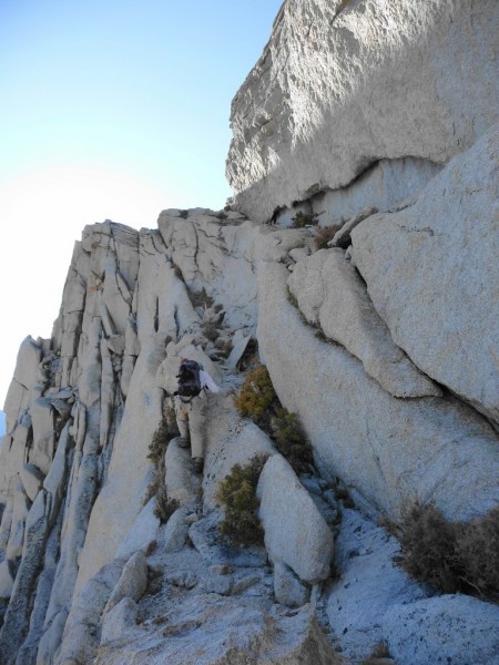 Me scrambling up to Thor Peak's summit plateau