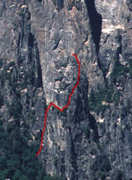 Climber on the first pitch with the route above.