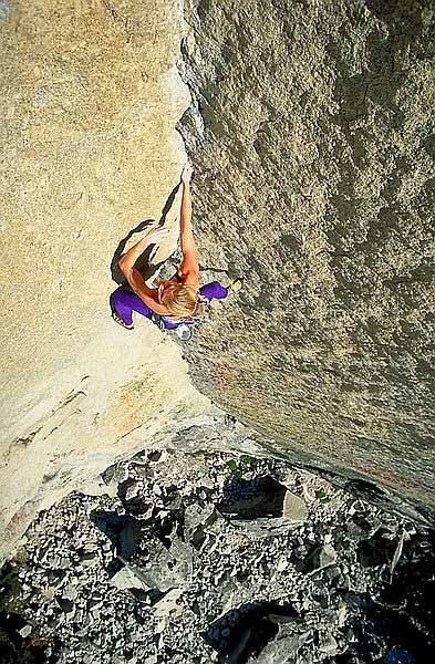 Mary leads the 5.10c overhanging stemming corner on Oz.