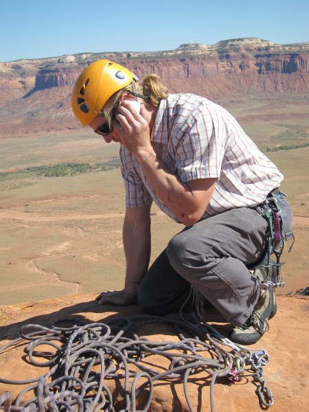 Mark finds a signal and calls Lisa from the summit.