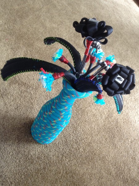 Vase made of rope. Flower made of retired cams, nuts, webbing and a ha...