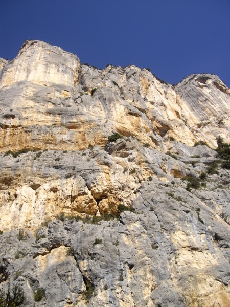 Looking up the height of the L'Escales cliff. Le Demande finishes in t...