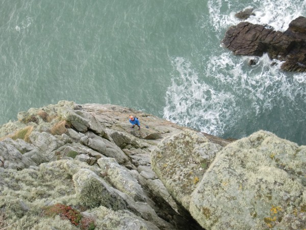 Looking down into the climb at Ed belaying Drew.