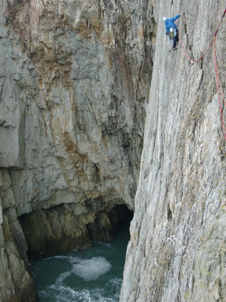 Me on the first pitch with a view of the zawn in the background.