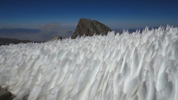 Polemonium summit with snow. Note the fire in the distance.