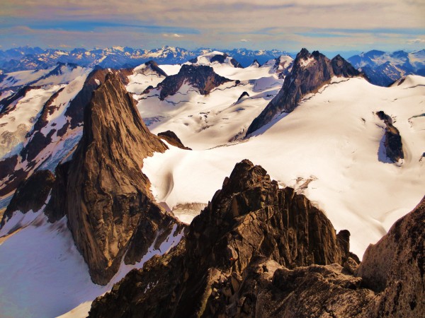 Looking down towards Snowpatch after climbing NE ridge of Bugaboo Spir...