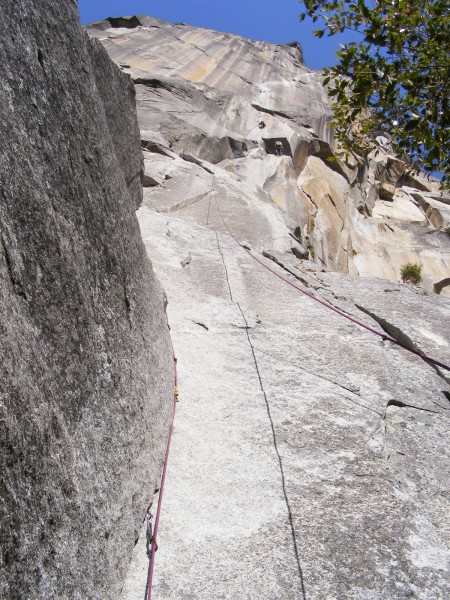 Looking up at the route after pitch 1, with the aid-cragging duo on pi...