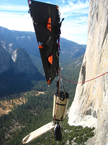 Flagged portaledge over Henri. Note the portaledge bag being blown hor...