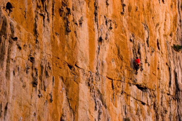 Climber on "Superman" at the Never Sleeping Wall.