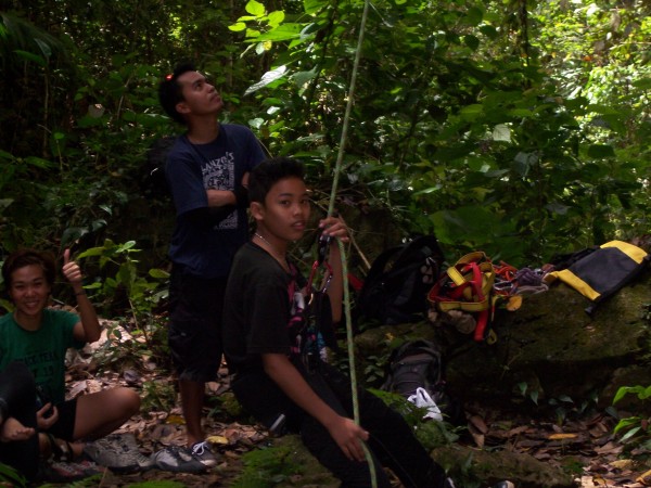 This young boy learned how to belay and is belaying his sister.