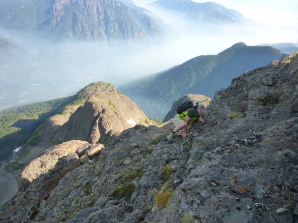 Carman topping out onto the summit block with purple haze flowing thro...