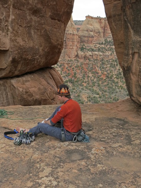 Prepping on the sandstone patio at the base of the route