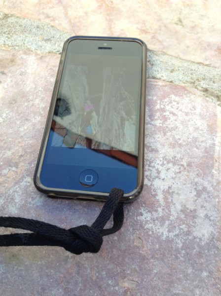 Connecting the lanyard to the iPhone case. I used a shoelace but you c...
