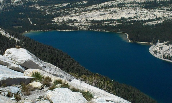 About to rope up, looking down on Tenaya Lake and something furry caug...