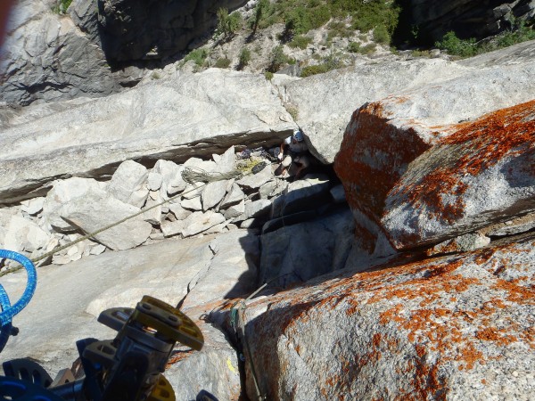 Looking down at Tom while he belays from the spacious block ledge with...