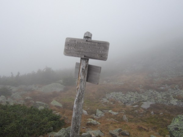 Trail junction signs were welcome waypoints on the cloudy ridge