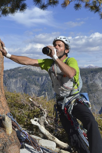 Steve chugging a Sierra Nevada with his hand on El Cap Tree after summ...