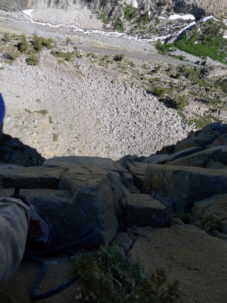 Looking down to the car from the third pitch belay.