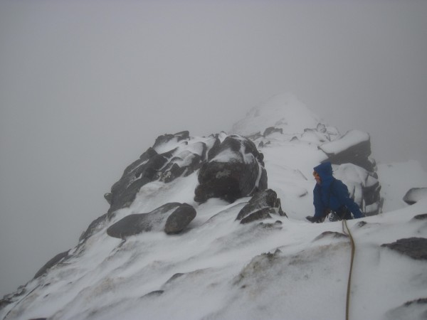 Susan planning our descent with the wind trying to blow her off the su...