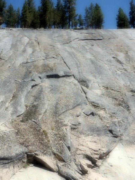 Up the arching flake, belay.  Trend left up to a pod, belay.  Top out,...