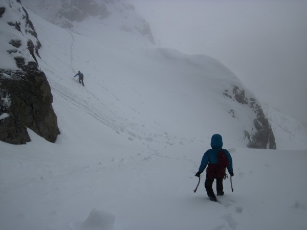 Brent &#40;down in front&#41; and Kendra hiking down an avi prone sect...