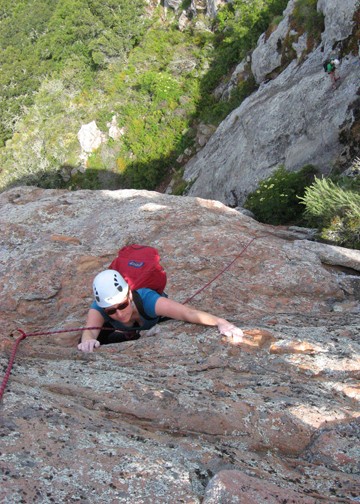 Claire nearing the top of Pitch 2 with Garden Wall below. Photo Slater...