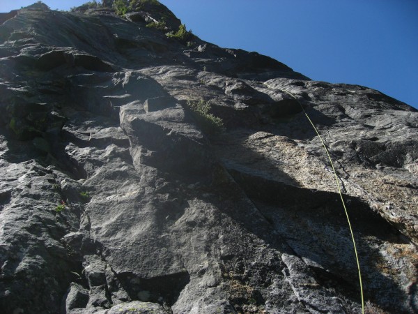 Scott somewhere in the dark rock of pitch 9/10, with the "mossy chimne...