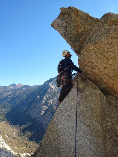 Geoff contemplating the highly exposed and reachy crux of the summit p...