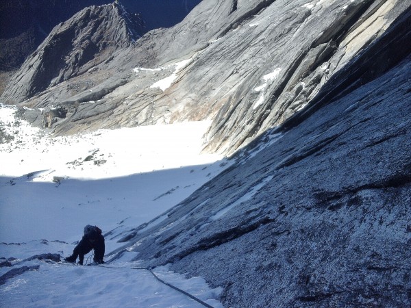 beyond the traverse the angle got steeper and the sheet of snow over t...