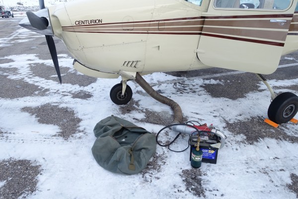 A propane and car battery preheater gets the engine ready for start. I...