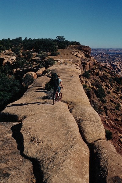 Tim riding out on a finger of sandstone to where we would set up our b...