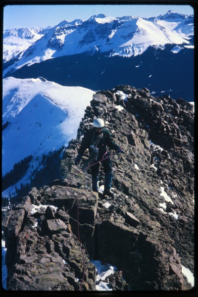 Charlie approaching the summit on a clear but windy winter day.