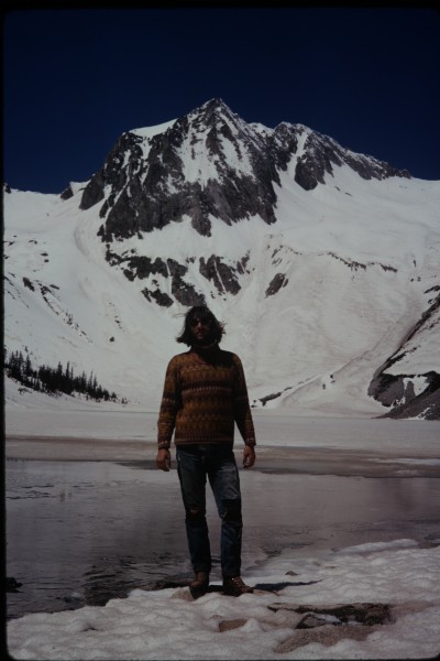 Charlie at Snowmass Lake, with the prominent east face of Hagerman Pea...