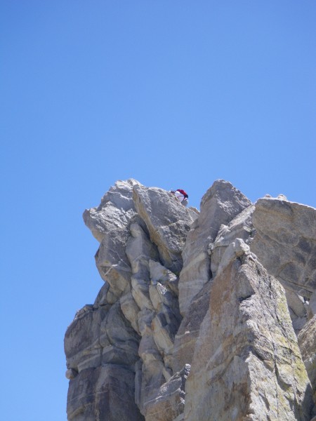 Peakbagger on true summit of Matterhorn, as viewed from top of North A...
