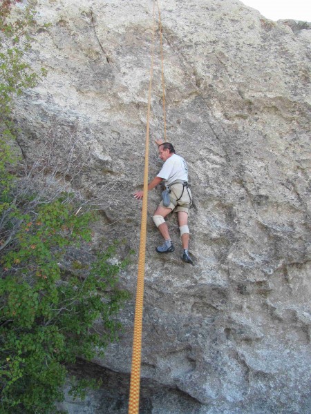 "Fritz" on Practice Rock 5.7/5.8 lerft side toprope. At halfway point.