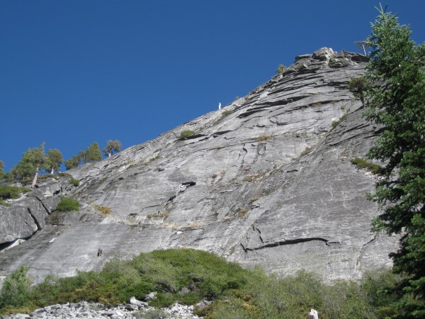 Route seen from approach, climbers on 1st pitch and at 2nd belay stati...