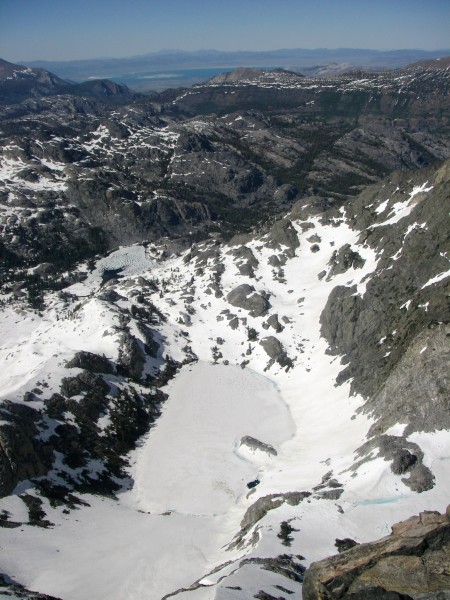 Mono Lake in the background, a very frozen Iceberg Lake in the foregro...