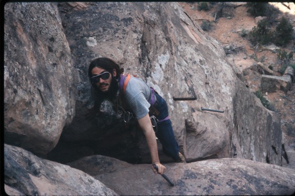 Charlie mid-way up Ottos route on Independence Rock in the Colorado N...