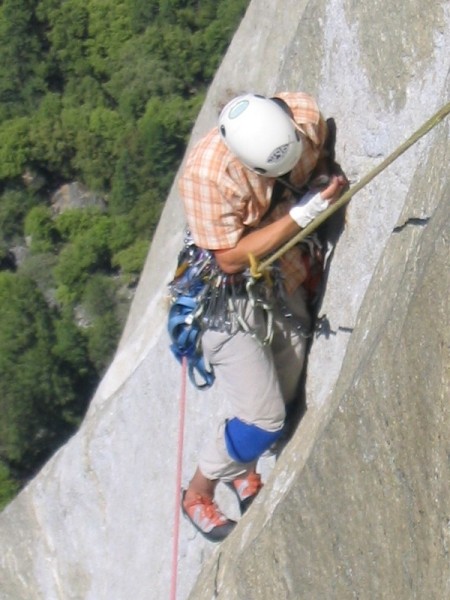 Johan Hvenmark trying to place some gear in a tiny shallow crack, King...
