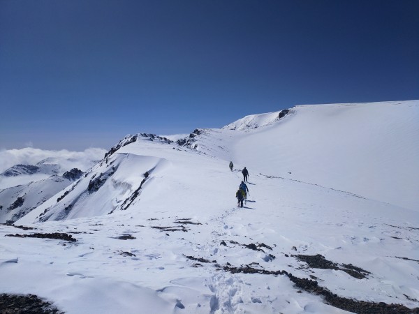 The windswept upper ridgelines above the buttress and along the lip of...