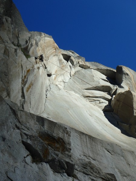 Climbing into the morning rays over Half Dome near the top of the Colu...