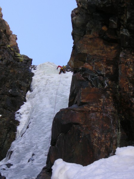 Placing the 4th and final screw just below the end of the ice and befo...