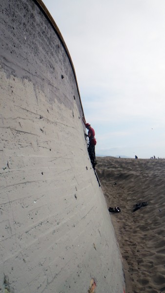 Aid bouldering at the beach. The sand could make for a nice landing.