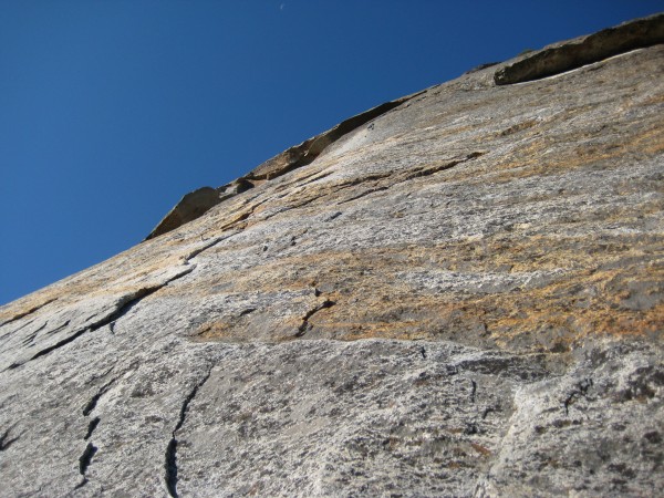 P5 crux - thin face protected by a bolt ladder up to a roof.